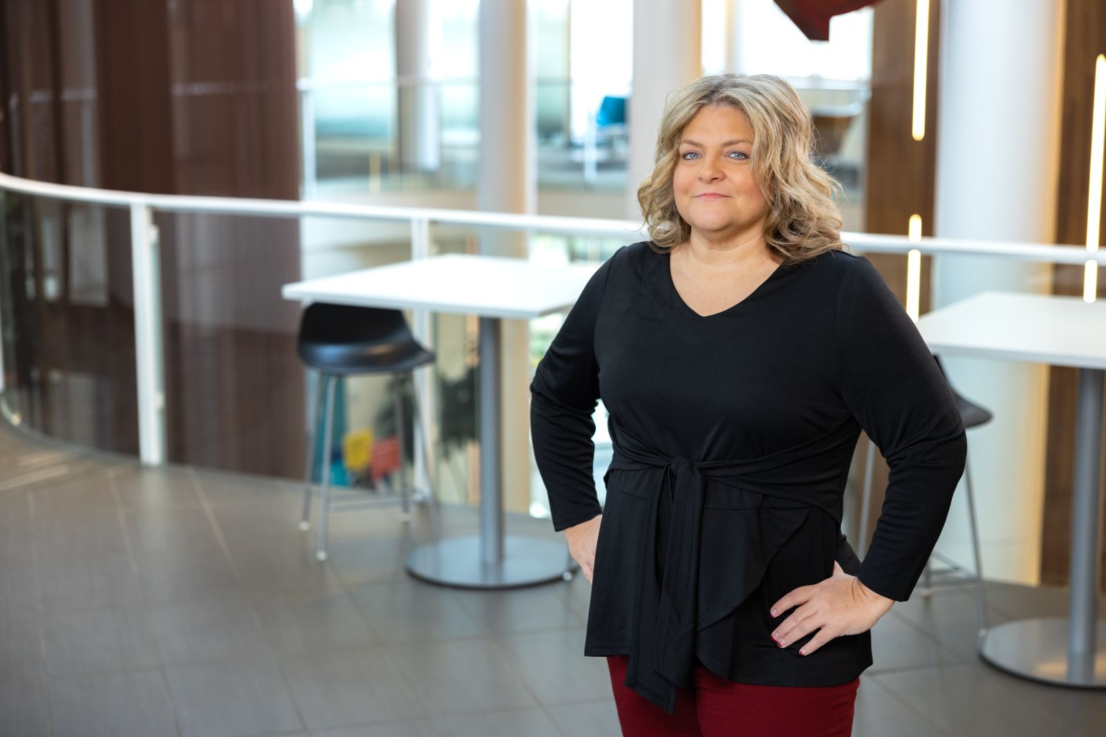 Dawn Mizell smiling standing in building
